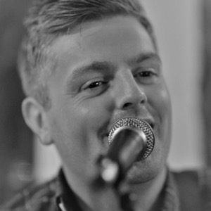 Musician singing into microphone