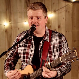 Singer playing guitar